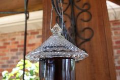 a hanging glass bottle filled with liquid