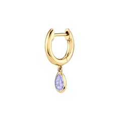 The sweetest yellow gold huggie that hugs tight to the ear is updated with a dash of sparkle by a delicate teardrop shaped tanzanite stone. 14k yellow gold.