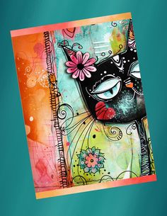 an artistic card with a black cat on it's face and flowers in the background