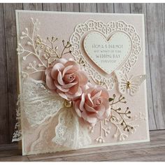 a card with some flowers and lace on it