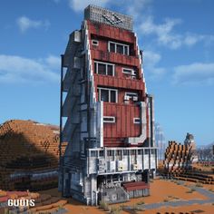 a tall red building sitting in the middle of a desert