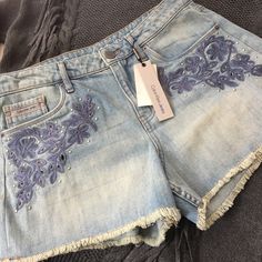 Calvin Klein Jeans Denim Highrise Shorts Size 28, Cutout And Embroidered, Silver Tone Embellishments, Light Wash, Small Fringe Hem Length - Approximately 11-1/2” - 12” Rise - Approximately 11” Waist - Approximately 15” Flat Brand New With Tags Embroidered Medium Wash Denim Jean Shorts, Embroidered Medium Wash Denim Shorts, Embroidered Denim Blue Jean Shorts, Embroidered Denim Jean Shorts In Blue, Blue Embroidered Denim Shorts, Blue Embroidered Short Length Jeans, Embroidered Short Denim Jeans, Embroidered Short Length Denim Jeans, Embroidered High Rise Denim Shorts