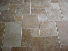 a tile floor with different colors and shapes