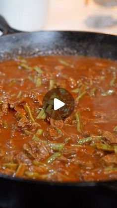 a skillet filled with food on top of a stove