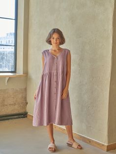 "PRODUCED in 3-5 days FAST & FREE shipping with DHL Express Courier -10% for all items with code \"FAVOURITE\" Made from pre-washed soft linen in a subtle lavender color with a light purple hue, this dress is for your natural charm. A v-neck, slightly emphasized waist and buttons at the front will make your outfit romantic and comfortable.  Details: - 100% Linen - Pure linen fabric - V neck - Flared silhouette  - Slightly emphasized waist - Two side pockets - Buttoned front - Above knee length - Comfortable fit - Model's height is 160 cm / 5'3'' wears size M - Code: E9021-L532-125 The dress is available in other colors. You can find them in the gallery. If you want to order the dress in another color, please specify it in the personalization field. Sizing: This garment is true to size, and Casual Purple A-line Midi Dress, Casual Purple Midi Dress For Daywear, Summer Purple Dresses With Pockets, Casual Lavender Knee-length Midi Dress, Sleeveless Mauve Midi Dress For Spring, Casual Lavender Midi Dress For Daywear, Lavender Midi Dress For Daywear, Purple Midi Dress For Summer Daywear, Lavender Sleeveless Day Dress