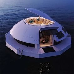 the inside of a boat floating on top of water with an open door to it