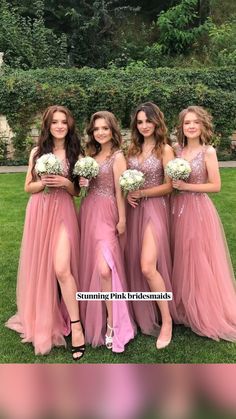 the bridesmaids are posing for a photo together in their pink gowns and high heels