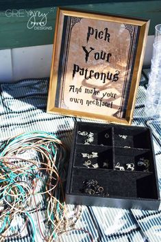 an open box sitting on top of a table filled with jewelry