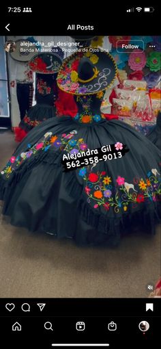 a black dress with colorful flowers on it