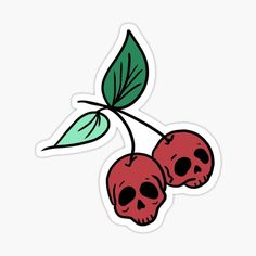 two cherries with skull heads sticker on white background, one is red and the other has green leaves