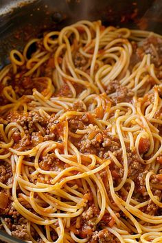 a pan filled with spaghetti and meat sauce