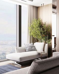 a living room filled with furniture and a large window overlooking the cityscape in the distance