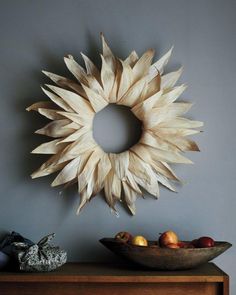 four different pictures of wreaths and decorations on the wall, including one with sunflowers