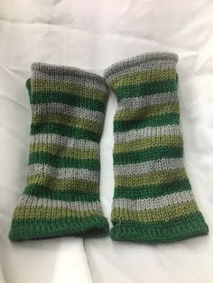 Green yellow black wool winter cuffs - made in Nepal - 100% wool exterior 8 3/4" long x 4" wide when measured flat on table 100% POLYESTER LINING DO NOT DRY WITH HEAT.  THIS HAT IS 100 % WOOL.  PLEASE HAND WASH AND LINE DRY.  100% WOOL HATS WILL SHRINK IF PUT IN A DRYER. Casual Green Leg Warmers For Fall, Green One Size Leg Warmers For Winter, One Size Green Leg Warmers For Winter, Wool Hats, Gray Winter, Striped Scarf, Wool Winter, Winter Gloves, Green Olive