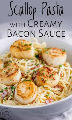 scallop pasta with creamy bacon sauce in a white bowl