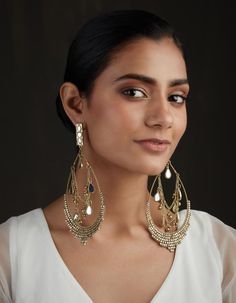 BIGGER IS BETTER WHAT IT IS: Extra large mirror studded dangler earrings WHY IT’S SPECIAL: Head turning style with it's combination of traditional workmanship and a modern over-sized look Dramatic and detailed, yet incredibly lightweight and comfortable to wear GOOD TO KNOW: Gold plated Bead and mirror work Weight - 29 grams Length - 16 cm WHY WE LOVE RITIKA SACHDEVA: Handmade in India, Ritika Sachdeva puts a quirky take on traditional designs. Her jewelry turns heads with their oversized and unique interpretations of a magical past. Extra Large Mirror, Lindsay Price, Extra Large Mirrors, Oversized Earrings, Dangler Earrings, Good To Know, Large Mirror, Mirror Work, Stunning Jewellery