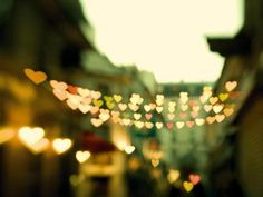 blurry photograph of street lights in the city at night with blurred back ground and white frame