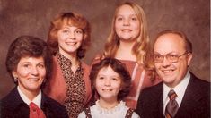 an older family poses for a photo