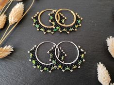 Elegant handwoven hoops with fire-polished Czech beads and Miyuki Delica Option 1 : Black/green & brass Option 2 : Black/green & sterling silver These beaded hoop earrings were designed to match the Coburn bracelets - both the hoop earrings and the bracelet are available as a jewelry set in my shop. I used a number of high-quality seed beads and fire-polished glass beads of well-known glass bead manufacturers for this design. The filled herringbone stitch was woven with resilien beading thread s Handmade Green Beaded Hoop Earrings, Green Round Beads Hoop Earrings For Festivals, Green Small Hoop Earrings With Tiny Beads, Green Hoop Earrings With Round Beads For Festivals, Green Tiny Beads Small Hoop Jewelry, Green Small Hoop Jewelry With Tiny Beads, Festival Green Hoop Earrings, Green Hoop Earrings For Festivals, Handmade Black Hoop Earrings Gift