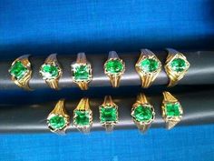 six different types of rings with green stones on them