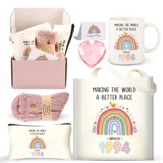 an assortment of personal care items including a mug, mitt and pillow in a gift box