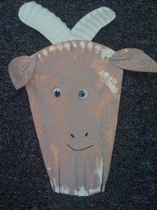 an animal made out of paper on the ground