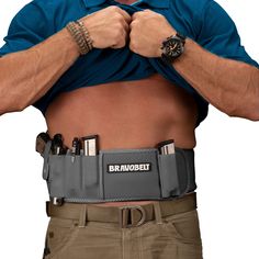 a man with his hands on his hips wearing a belt that says bravobett