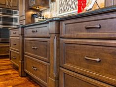 a kitchen with wooden cabinets and stainless steel appliances