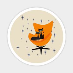 an orange chair with a black cat sitting on it's back and stars in the background