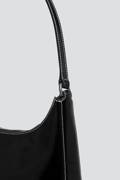 Black Leather Alec Bag from Staud. Classic structured shoulder bag. Minimal silver hardware details. Suede lining. - 100% Leather - Length: 11" / depth: 2.5" / height: 11.5" / strap drop: 10" Staud Rectangular Formal Shoulder Bag, Staud Formal Rectangular Shoulder Bag, Formal Rectangular Staud Shoulder Bag, Staud Elegant Leather Shoulder Bag, Elegant Staud Leather Shoulder Bag, Staud Luxury Leather Shoulder Bag, Staud Satchel Shoulder Bag For Evening, Classic Staud Bags, Staud Formal Shoulder Bag