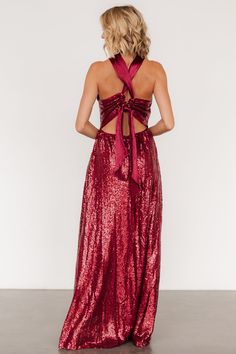 This eye catching dress is designed to make you dazzle at any occasion All burgundy color Sequins throughout tulle material Criss cross gathered halter neckline Pleated tank sleeves Open back style with zipper Criss cross straps with tie detail at back Fitted bodice with flowing maxi skirt Fully lined Self and Lining: 100% Polyester Contrast: 97% Polyester, 3% Spandex Trina is 5'6, cup size 32D, size 2 and is wearing size S Tie Back Evening Dress For Prom Season, Tie-back Evening Dress For Prom, Prom Season Evening Dress With Tie Back For Party, Prom Season Party Evening Dress With Tie Back, Prom Season Party Dress With Tie Back, Glamorous Evening Dress With Tie Back, Evening Dresses With Crisscross Straps For Prom Season, Glamorous Tie Back Halter Dress For Prom, Glamorous Tie-back Halter Dress For Prom