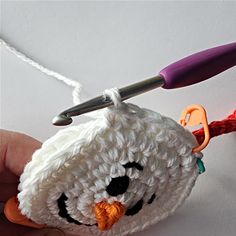 a crochet penguin ornament being worked on