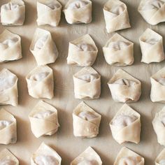 dumplings on a baking sheet ready to go into the oven