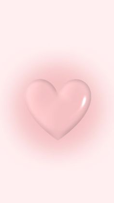 a heart shaped object on a pink background