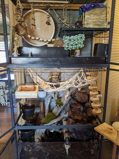 a bird cage filled with lots of different items