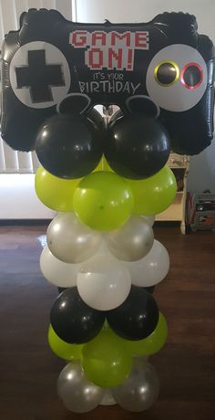 a bunch of balloons that are in the shape of an eyeball and some other items