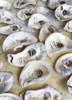 several oysters with gold writing on them