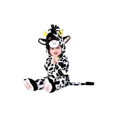 a baby in a cow costume sitting on the floor