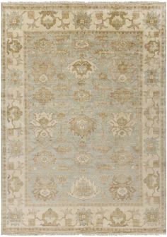 an antique rug with many different colors and patterns on the carpet, including beiges, blue