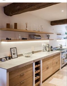 the kitchen is clean and ready to be used for cooking or baking, as well as wine glasses