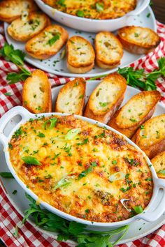 baked bread and cheese in white casserole dishes on a red checkered tablecloth