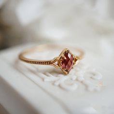 ♠ Metal: Real 10K yellow gold. Not plated or gold-filled. with G10K mark. Center Stones: natural garnet, marquise shape, roe cut, 2.9 x 5.3 mm ♠Shipping: *Free US domestic shipping via USPS First Class Mail with tracking number. ♠ Returns & Cancellations: Kt gold x Gemstone jewelry is considered customized orders in our shop. Kindly note we DO NOT accept return or exchange for this item. ♠ Care: To prolong the color and shine of your jewelry, avoid contact with perfume, lotion, and water. Store Cute Engagement Rings, Zierlicher Ring, Traditional Diamond, Promise Ring Gift, Gold Rings Fashion, Unique Engagement Ring, Sparkly Things, Jewelry Lookbook, Ring Dainty