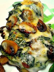 an image of a plate of food with mushrooms and spinach on it's side