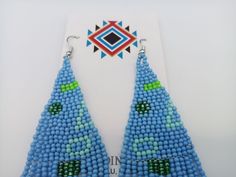 Amazing Turquoise Color Modern Powwow Native American Style Seed Bead Earrings with a variety of native colors in a non-traditional design. Stainless steel ear wires and genuine high quality beads. A beautiful combination of colors and native design at a super price. All handmade. Shipped Free Traditional Turquoise Beaded Earrings For Festivals, Southwestern Style Blue Festival Earrings, Southwestern Style Blue Earrings For Festivals, Handmade Southwestern Blue Beaded Earrings, Southwestern Blue Beaded Earrings With Round Beads, Traditional Blue Beaded Earrings, Green Southwestern Beaded Earrings Gift, Traditional Turquoise Teardrop Beaded Earrings, Southwestern Green Beaded Earrings For Gift