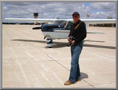 a man standing in front of an airplane