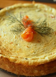 there is a pie that has been decorated with flowers and herbs on it's crust