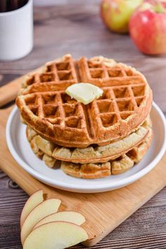 apple cinnamon waffles on a white plate with text overlay that reads, get the recipe