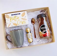 an open box containing coffee, nuts and other items to make it look like they are in the middle of a meal