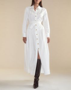 Crisp white cotton shirt dress. Classic collar Gold buttons down front Long sleeves with gold button cuff Maxi length Comfortable, relaxed fit with a cinched waist for a flattering silhouette Complete with a detachable tie belt to accentuate the waist Fabric content: 100% cotton Care instructions: dry clean recommended, machine wash cold, hang dry Fit: model is 5'9" and wears a size S. Size small measurements: Length from shoulder: 48" Final Sale White Shirt Dress With Button Cuffs For Daywear, White Belted Shirt Dress For Work, Elegant Cotton Shirt Dress With Belted Cuffs, Classic White Shirt Dress For Fall, Shirt Dress White, White Cotton Shirt, Button Shirt Dress, Cotton Shirt Dress, Maxi Dress Cotton