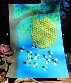 an art project is being displayed on the screen, and it looks like bees are flying around